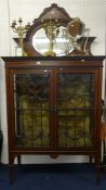 Edwardian mahogany two door display cabinet, with upper mirror and cross banding,