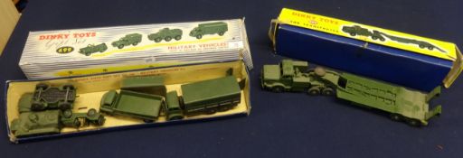 A collection of various Dinky Toys including military vehicles.