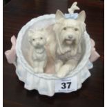 A Lladro group 'Two Dogs in a Basket'.