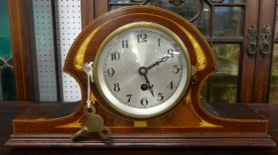 A French mantle clock with mahogany chequered cross banded and inlaid case.