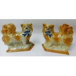 A pair of 19th century standing dogs possibly Staffordshire Pottery.