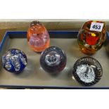 Five modern paperweights.