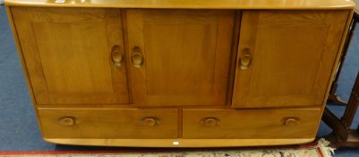 An Ercol light elm sideboard, Ercol plate rack and corner cabinet.