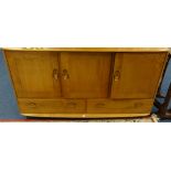 An Ercol light elm sideboard, Ercol plate rack and corner cabinet.