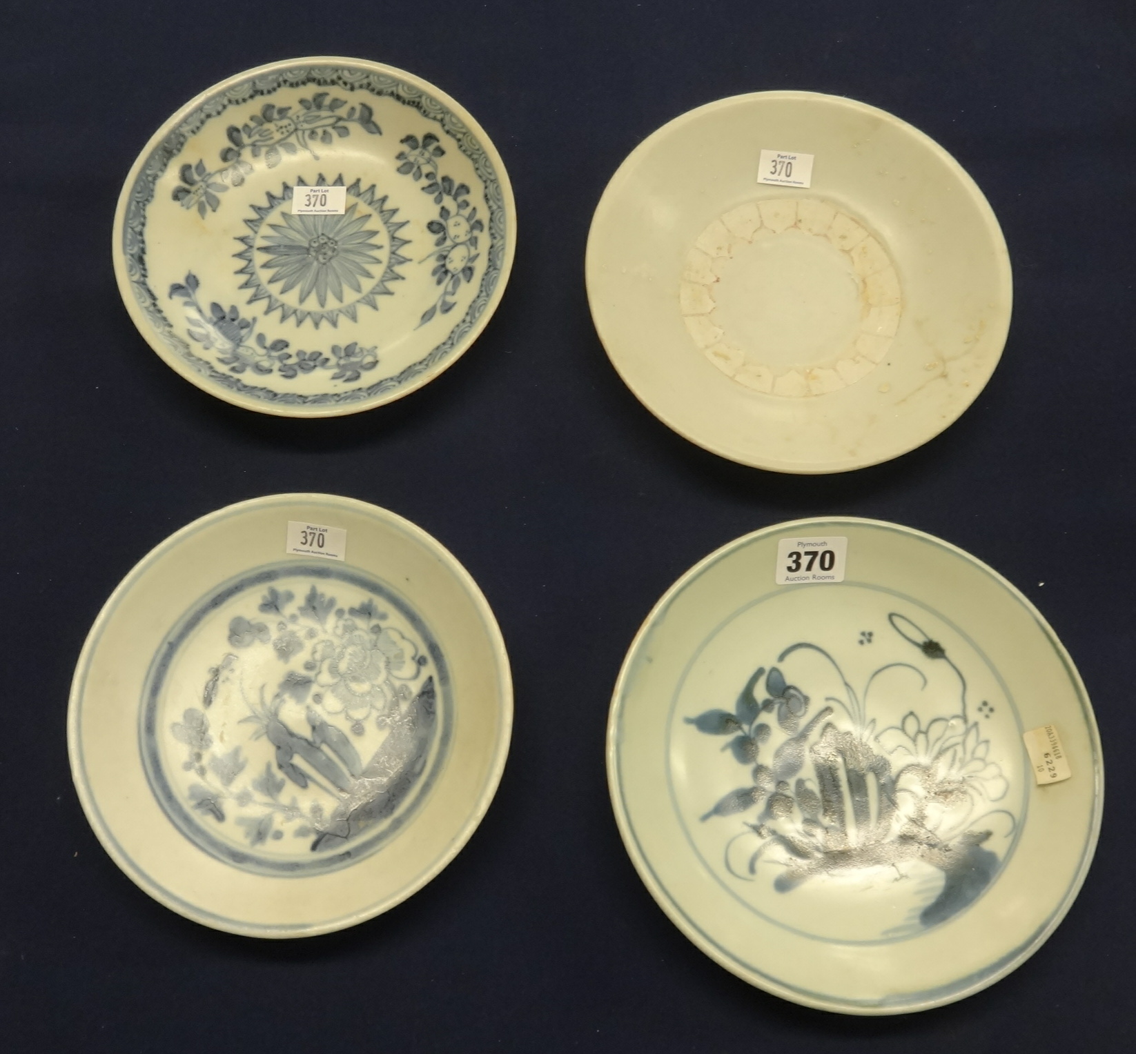 Tek Sing Cargo, four various patterned blue and white porcelain dishes.