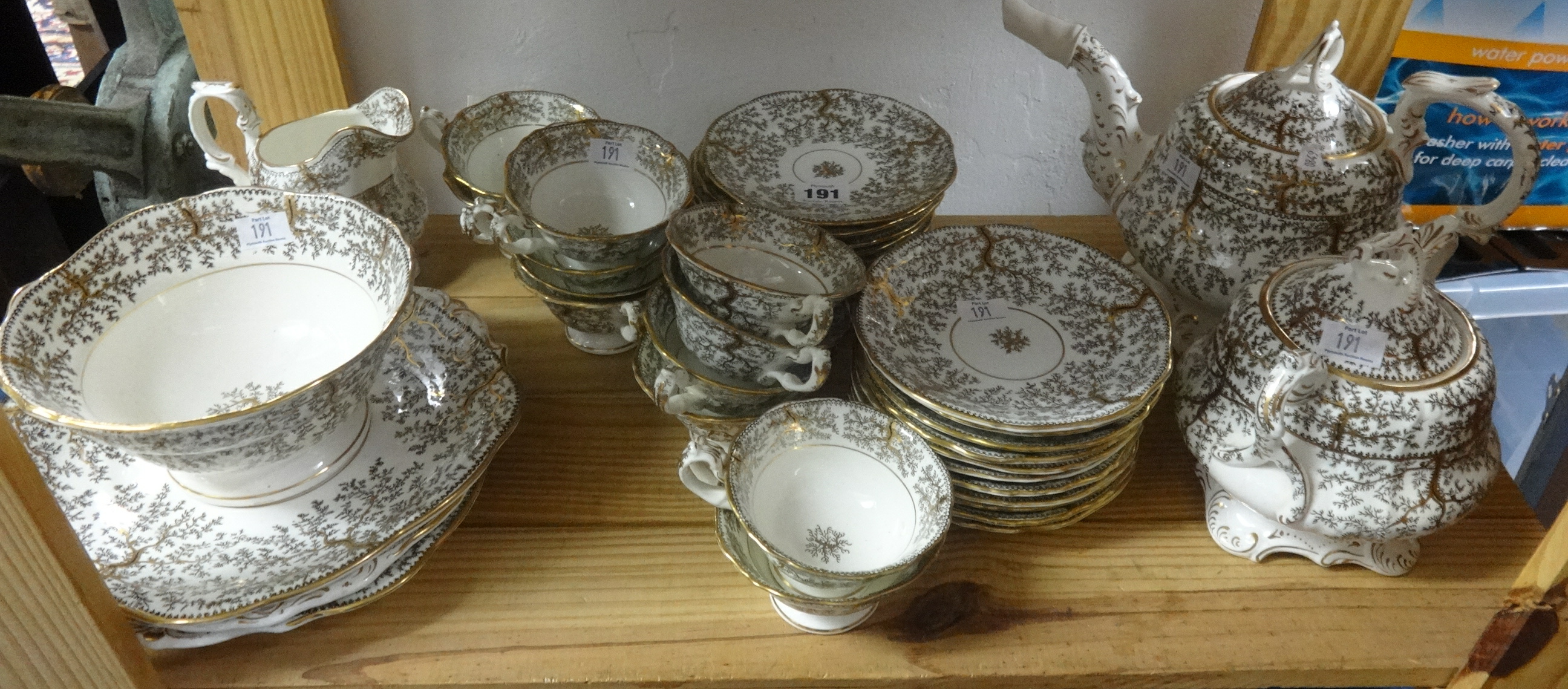 A 19th Century gilt patterned tea service, marked 'GFB Fibre'.