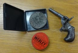 A Lusitania medallion and a starting pistoll, stamped J. GANSCHUTZ