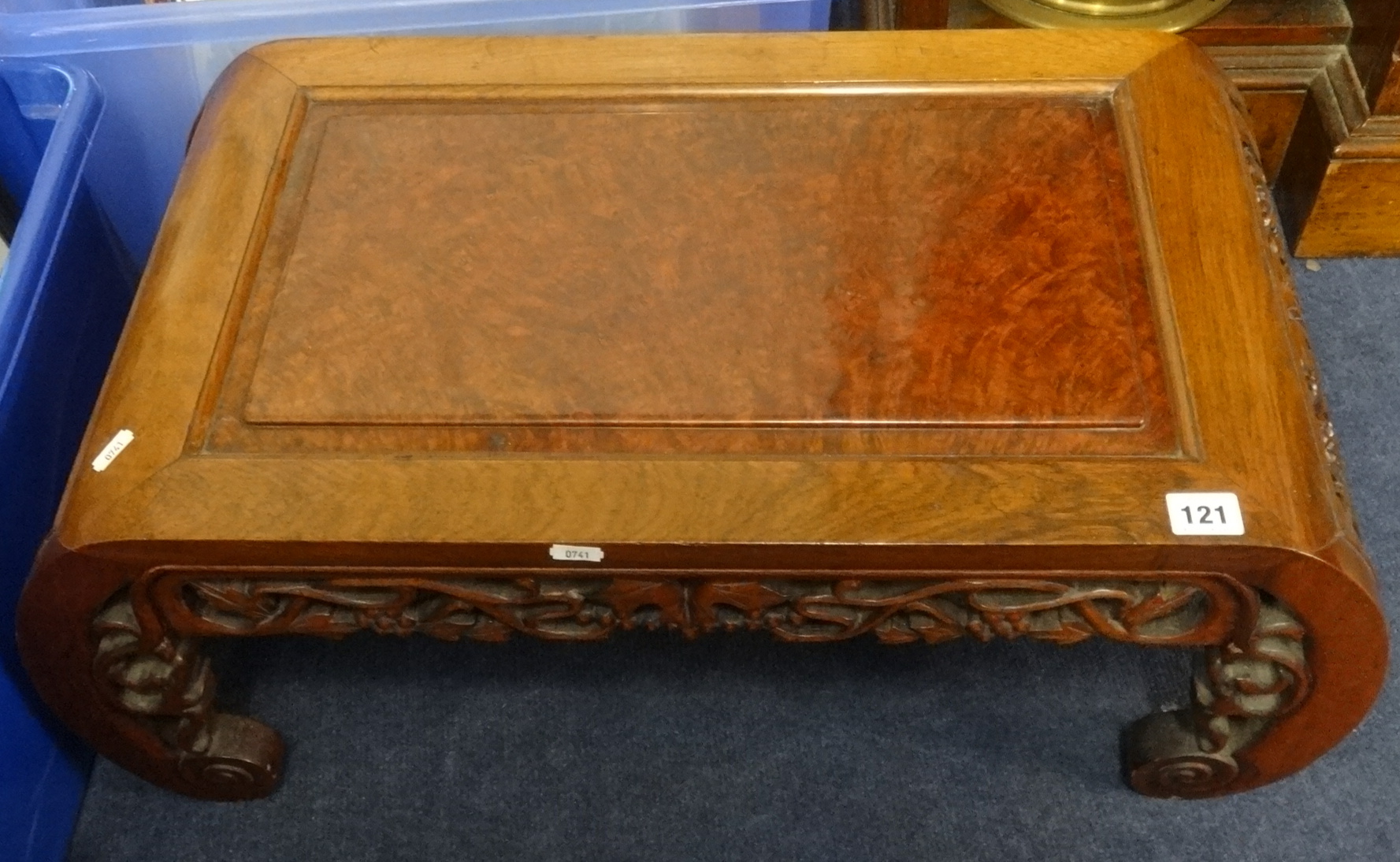 A carved hardwood opium table.