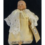 A German bisque head doll (head damaged), marked 'No 4' with composition body, height approx 30cm
