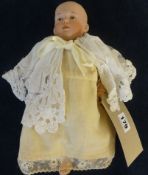 A German bisque head doll (head damaged), marked 'No 4' with composition body, height approx 30cm