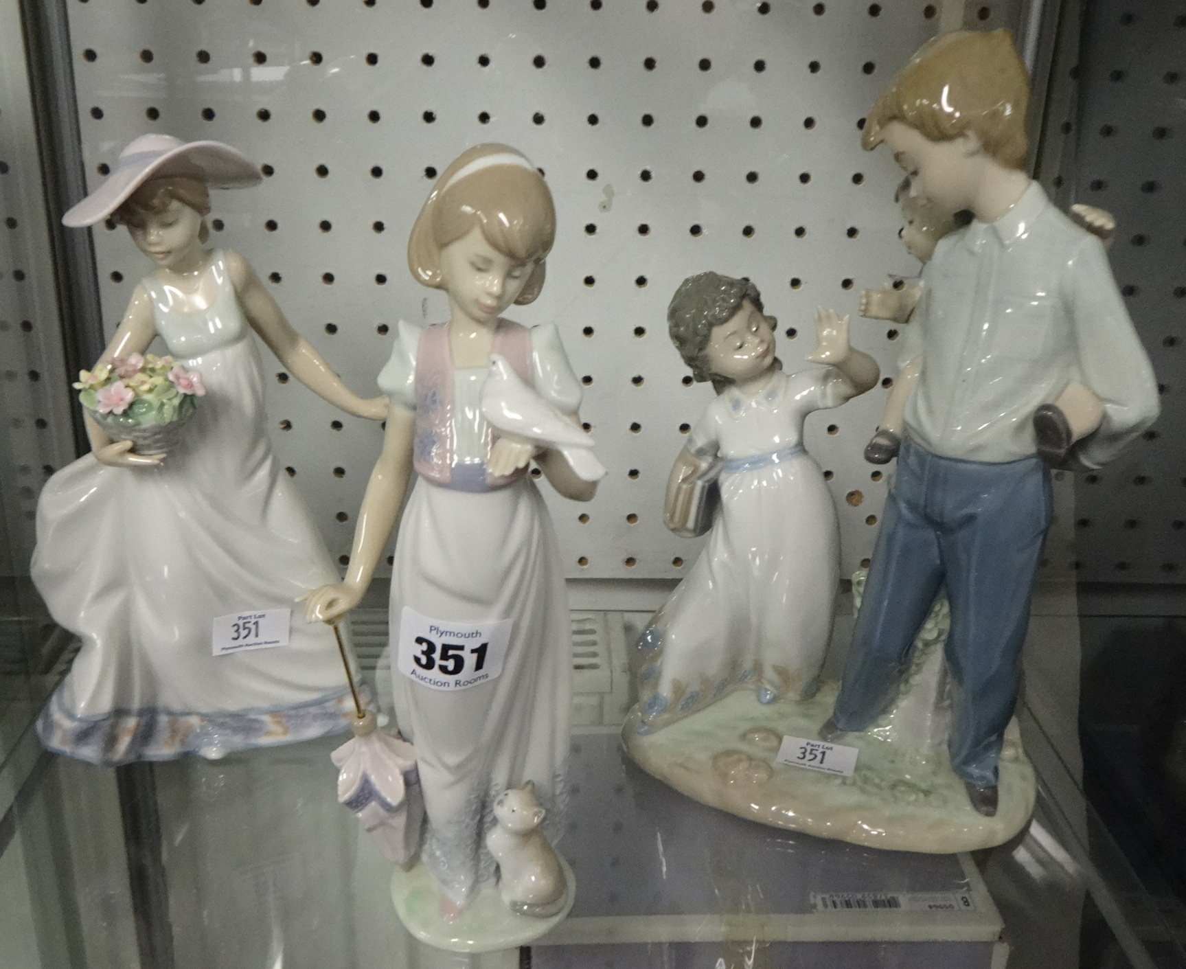 Lladro, a family group no 5702 and two other groups each boxed.