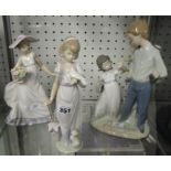 Lladro, a family group no 5702 and two other groups each boxed.