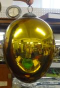 A glass 'witches' ball in gold.