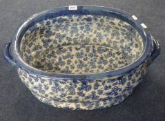 A reproduction Victorian blue and white footbath or planter, width 44cm.