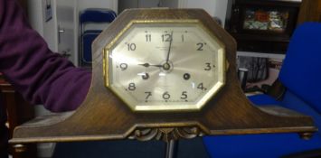 An oak cased mantle clock circa 1920, retailers Page, Keen & Page.