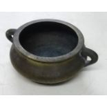 Chinese bronze censer of squat form, 17cm diameter with signed character marks to the base.