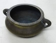 Chinese bronze censer of squat form, 17cm diameter with signed character marks to the base.