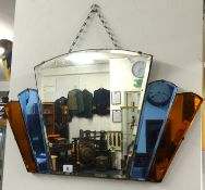 An Art Deco mirror with coloured plates.