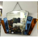 An Art Deco mirror with coloured plates.