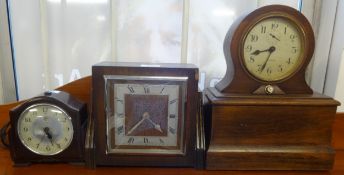 Three electric vintage wall clocks (one has alarm and light).