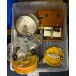 Five fishing reels including large aluminium 15cm diameter reels, also a scientific measuring