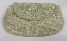 A quantity of various costume jewellery, evening bags and leather cases etc.