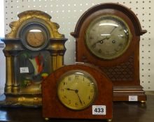 A burr walnut cased mantel clock by Colin Wood, with Swiss movement also a pottery cased clock and