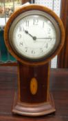 An Edwardian mahogany cased 'balloon' clock with key and pendulum