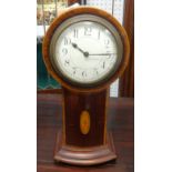 An Edwardian mahogany cased 'balloon' clock with key and pendulum