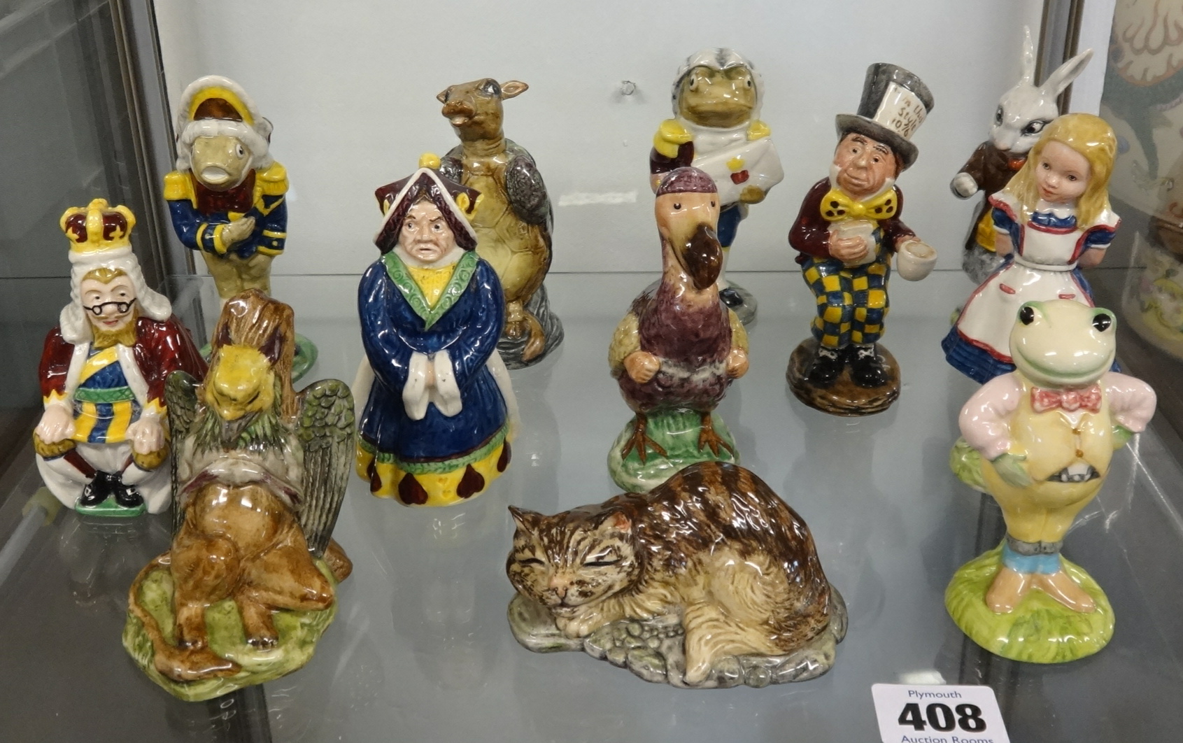 Beswick, Alice in Wonderland series eleven figures plus a Royal Albert figure 'Toad' (12).