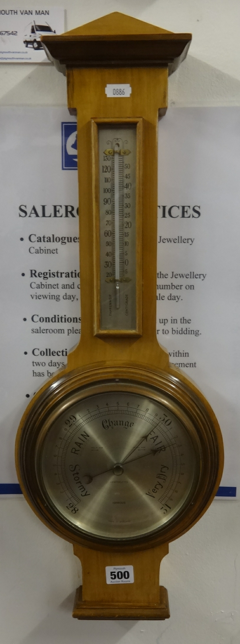 A Harrods compensated wheel barometer, in light mahogany case, height 64cm.