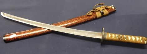 A reproduction Japanese samurai sword and a similar short sword with stands, accessories,