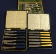Two cased sets of tea knifes and two cased sets of fish knifes and forks.
