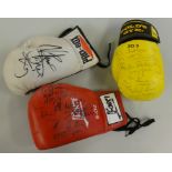 Three signed boxing gloves, multiple signatures including Scott Dann and Tim Wetherspoon etc, also