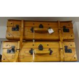 Two large tan leather suitcases, approx 75cm long with keys.