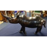 Large carved hardwood Rhino, 66cm long.