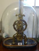 A brass skeleton clock with fussee movement, under glass dome, overall height 36cm.