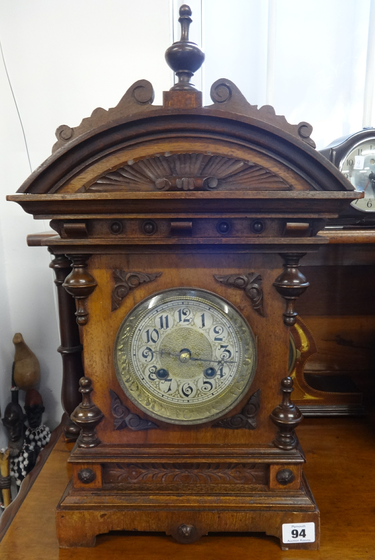 A 9th century German architectural wood cased mantle clock with strike on gong, with key and