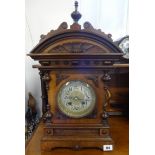A 9th century German architectural wood cased mantle clock with strike on gong, with key and