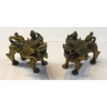 A pair of gilt possibly bronze Chinese dogs, height 10cm.
