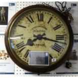 A large electric wall clock circa 1922 diameter 22 inches.