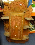 A mahogany two drawer writing table, with gilt work, also a carved fretwork wall hanging cabinet (