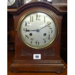 Junghams mantle clock with 8 day movement, silvered dial, strike on gong, with key and pendulum.