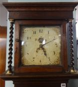 An early 19th Century oak long case clock with thirty hour movement, weight and pendulum, square