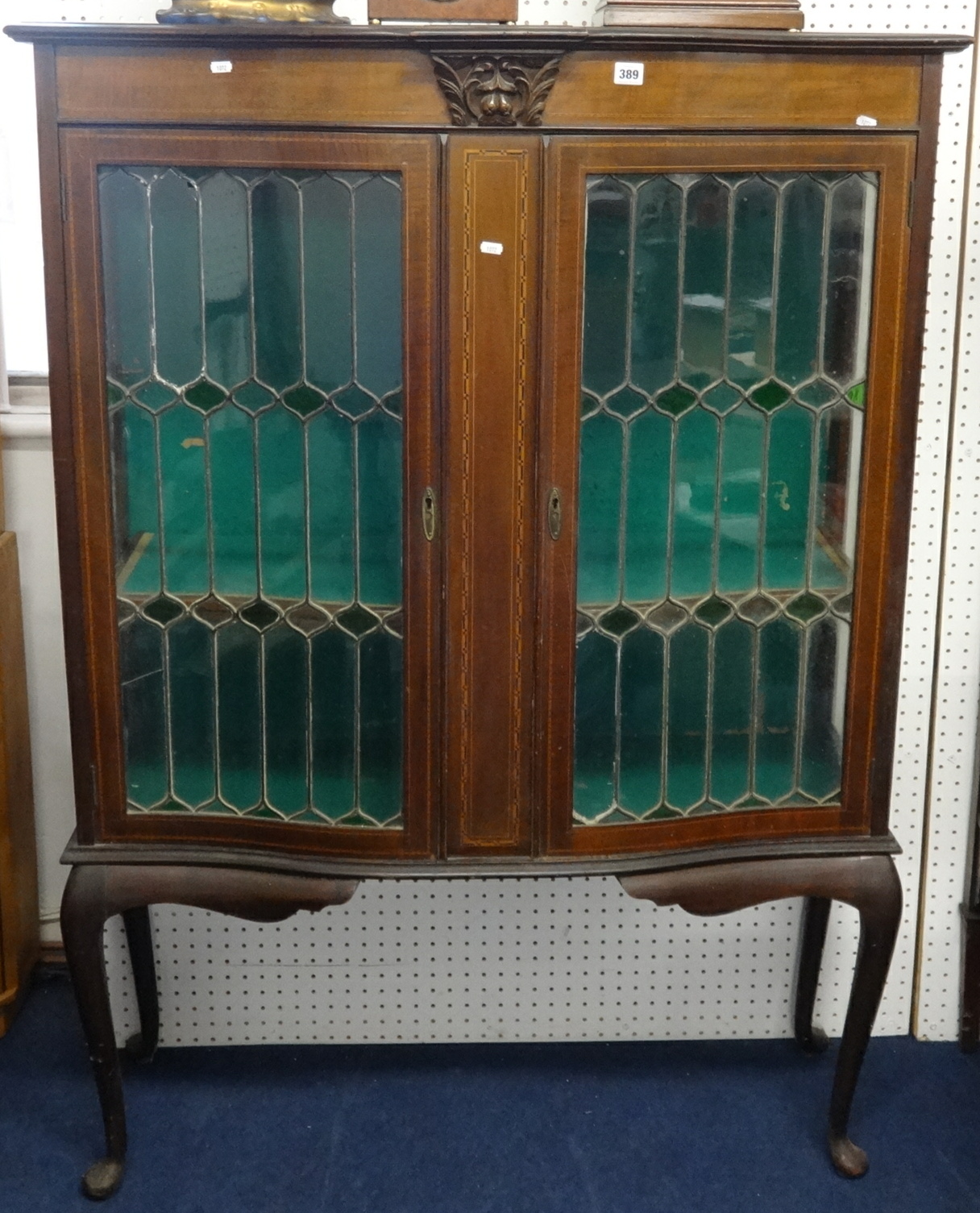An Edwardian mahogany two door display cabinet