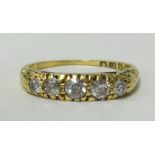 An 18ct gold, five stone ring, finger size M1/2.