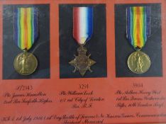A framed collection of three medals awarded for First Day Battle of Somme 1914-1915 Star and two