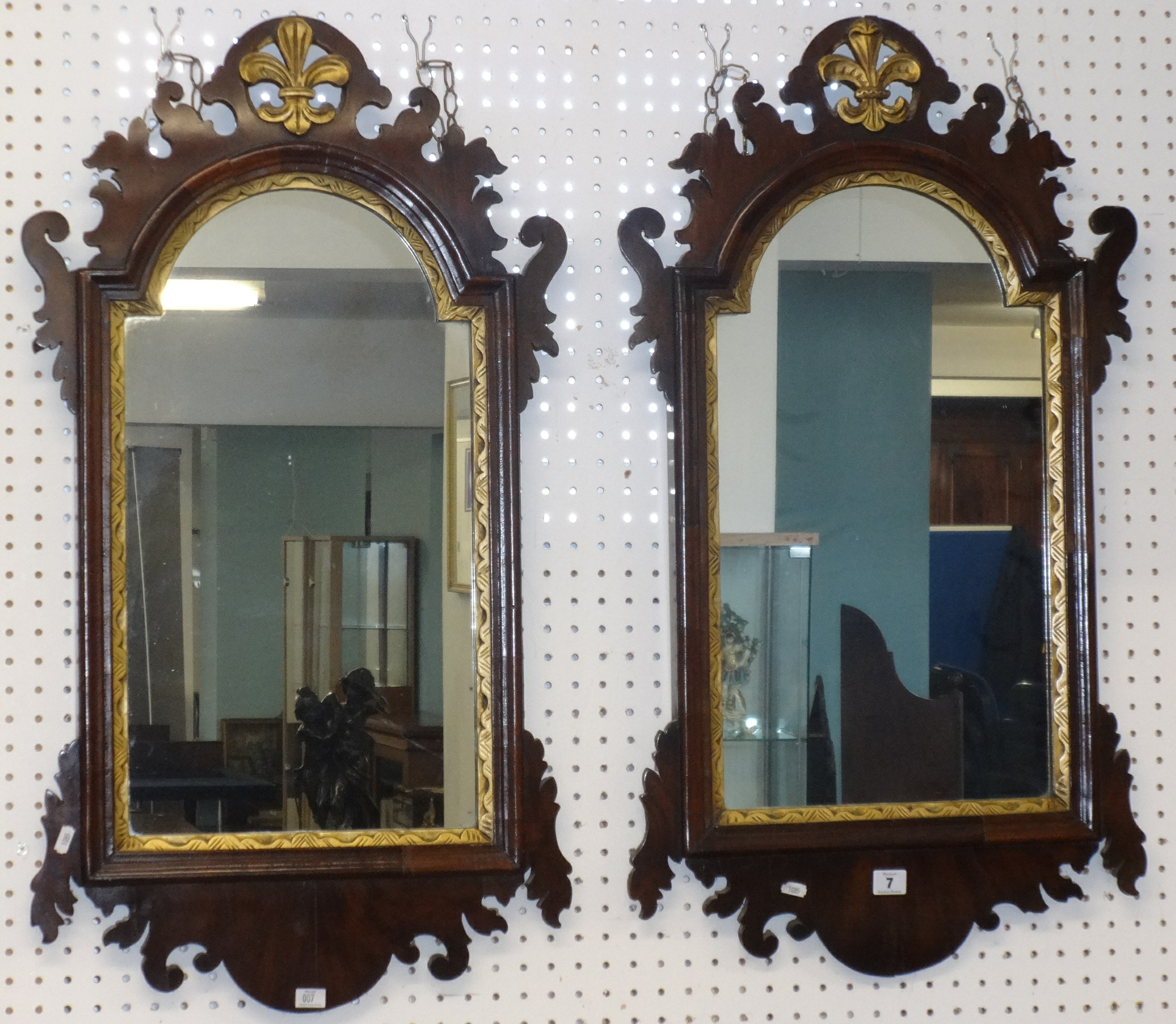 A pair of 19th Century mahogany framed parcel gilt wall mirrors, approx 80cm x 49cm maximum size.
