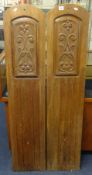 A pair of carved oak panels, height 133cm.