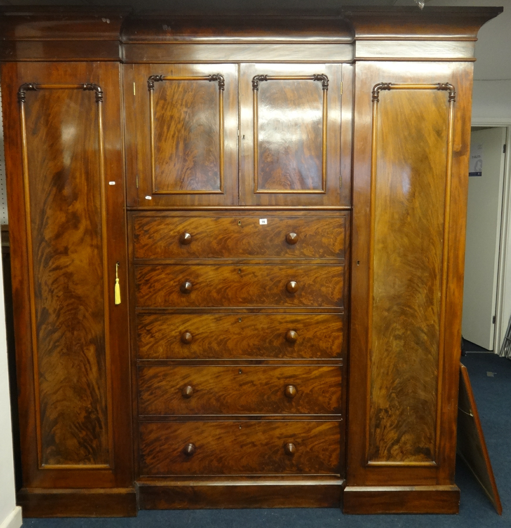 A 19th century mahogany Sentry compactum wardrobe, the pair of full length hanging cupboards